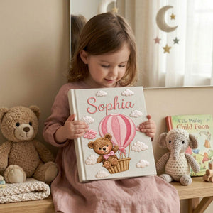 Personalized hand embroidered baby photo album with teddy bear in pink hot air balloon and fluffy embroidered clouds